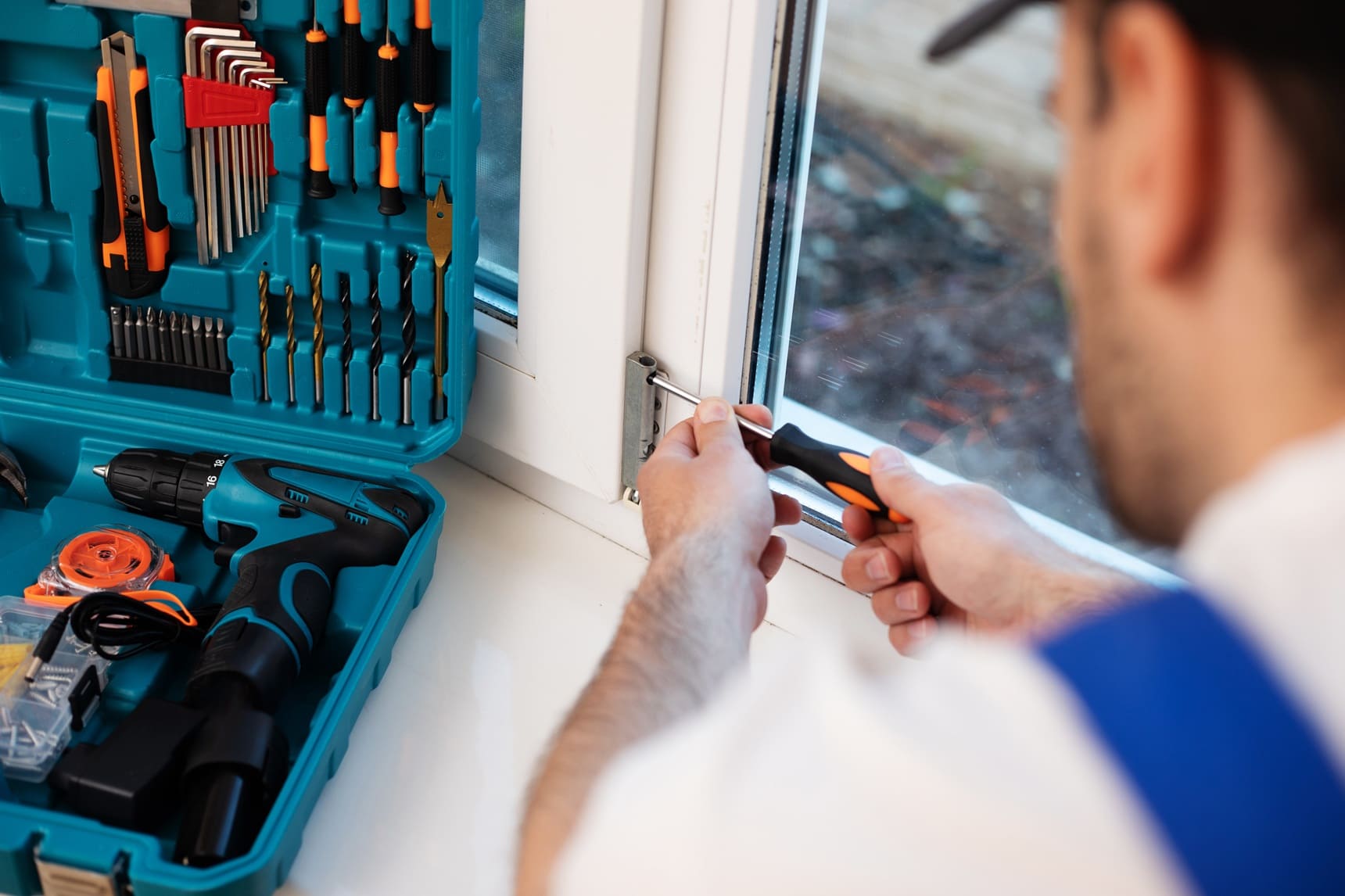 young-professional-worker-man-uniform-suit-is-installing-window-with-help-tools